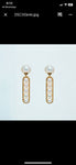 Dangle yellow gold pearl earrings