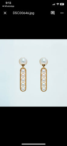 Dangle yellow gold pearl earrings