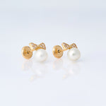 yellow gold bow and pearl earrings