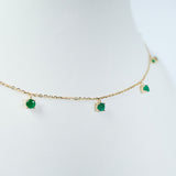 Emerald dancing yellow gold necklace