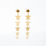 Long star earrings yellow gold