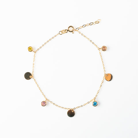 dancing yellow gold circles and color stone bracelet